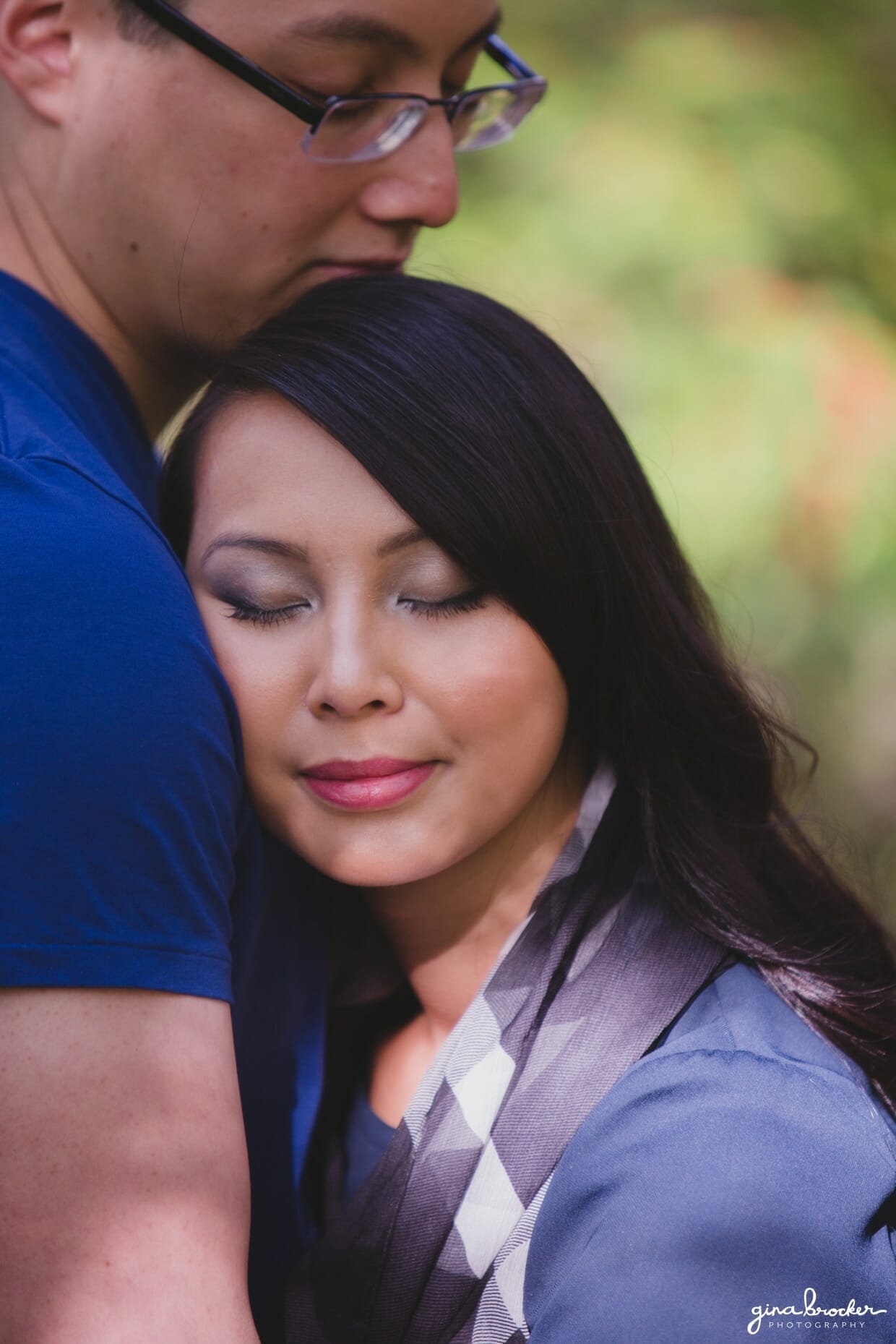 A sweet portrait of a couple snuggling during their fall themed boston engagement session