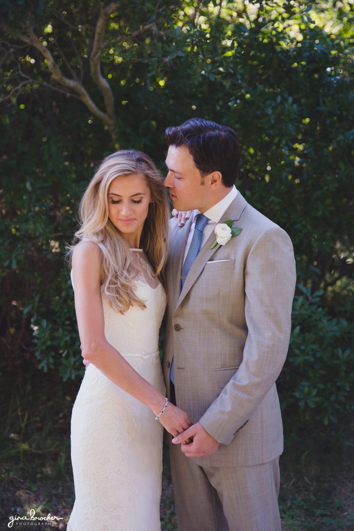 A sweet portrait of a bride and groom during their first look on the grounds of the Westmoor Club in Nantucket, Massachusetts