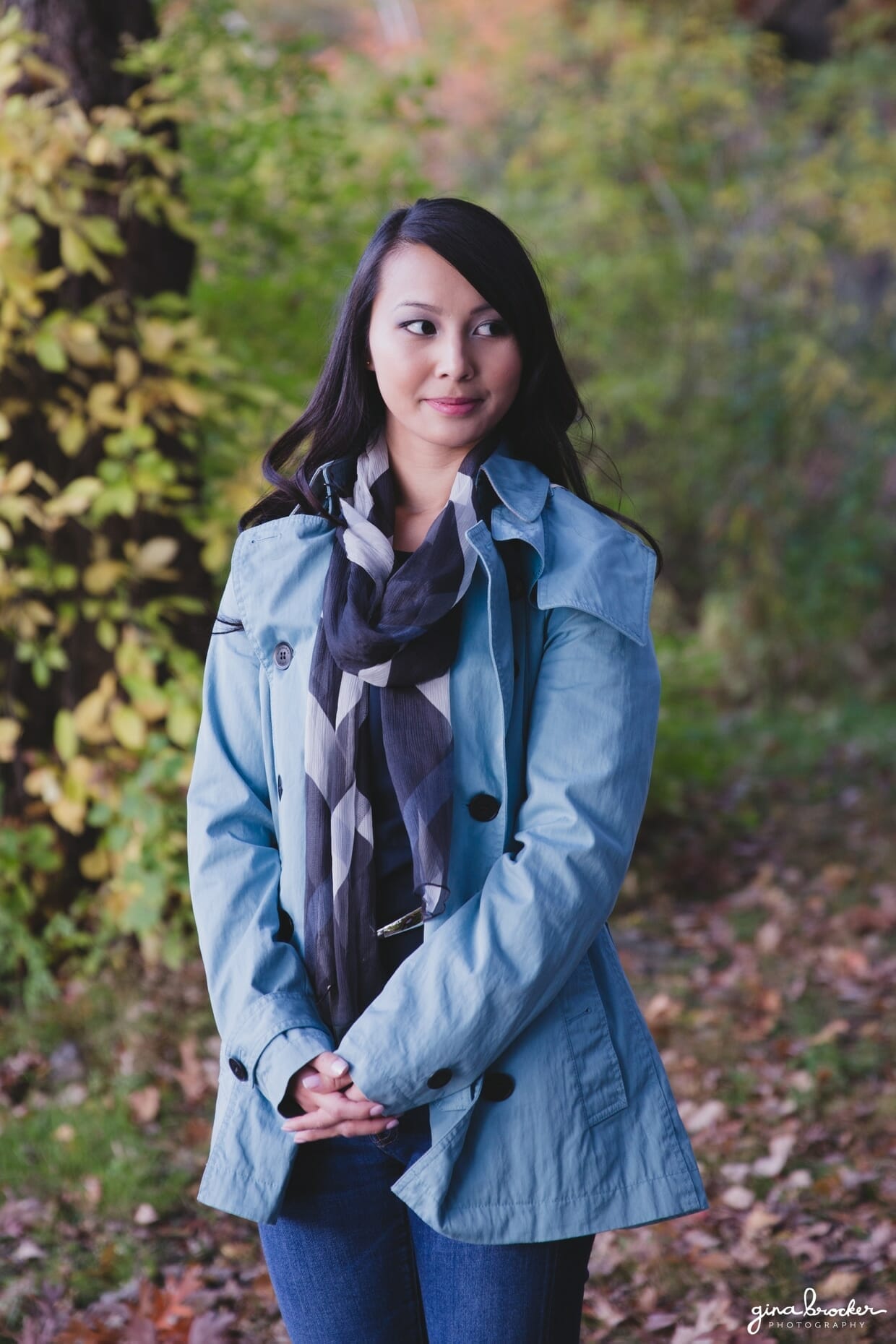 A portrait of a bride to be in the woods during her fall engagement session in boston
