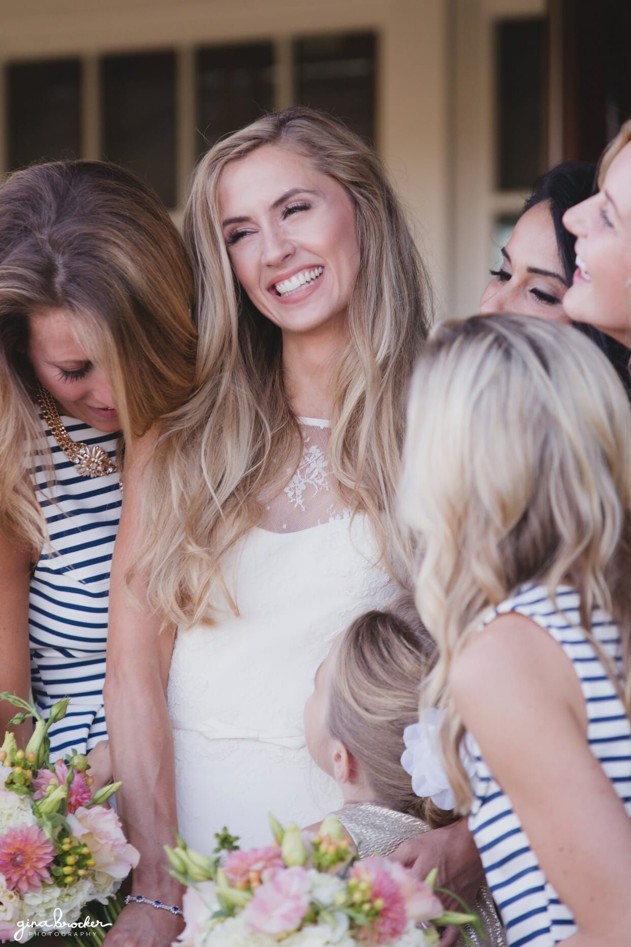 A bride laughing with her bridesmaids during their Westmoor Club wedding in Nantucket, Massachusetts