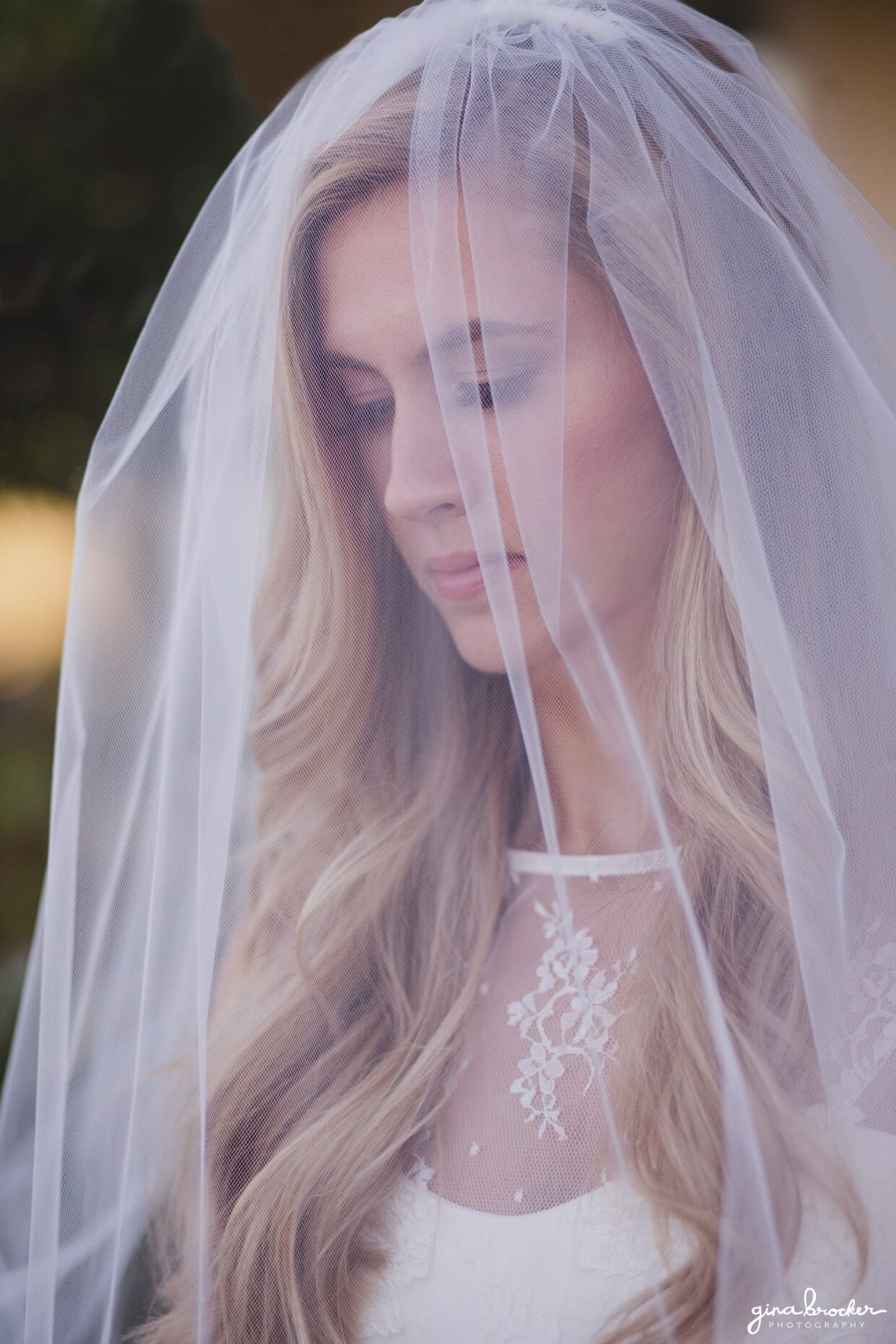 A portrait of a bride wearing her veil before she walks up the aisle during her Nantucket wedding at the Westmoor Club