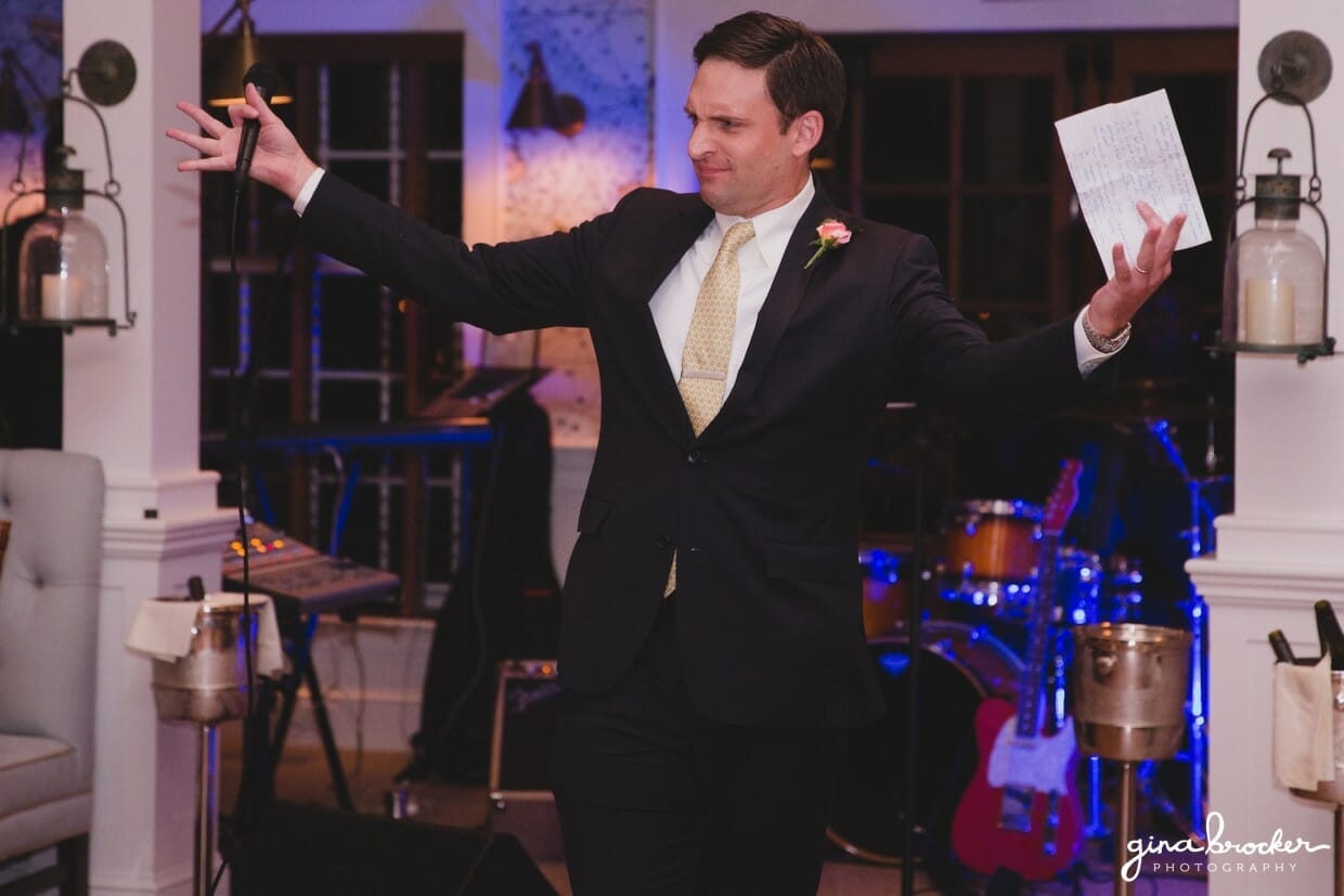 A candid photograph of the best man asking for a cheer during his wedding toast at the Westmoor Club in Nantucket, Massachusetts