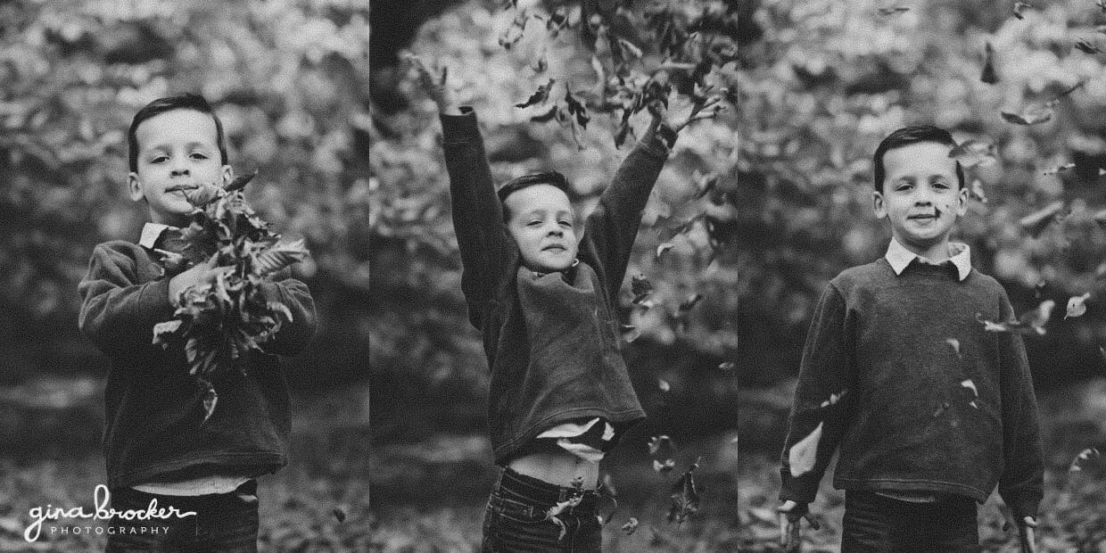 A cute photograph of a boy throwing leaves into the air during a fall family photo session in Arnold Arboretum