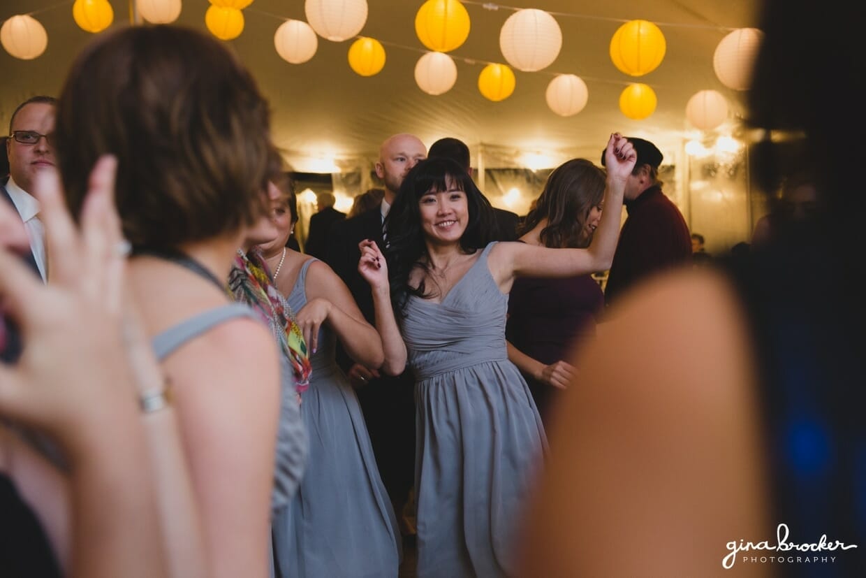 Guest celebrate and dance at a farm wedding in Oxford, Massachusetts
