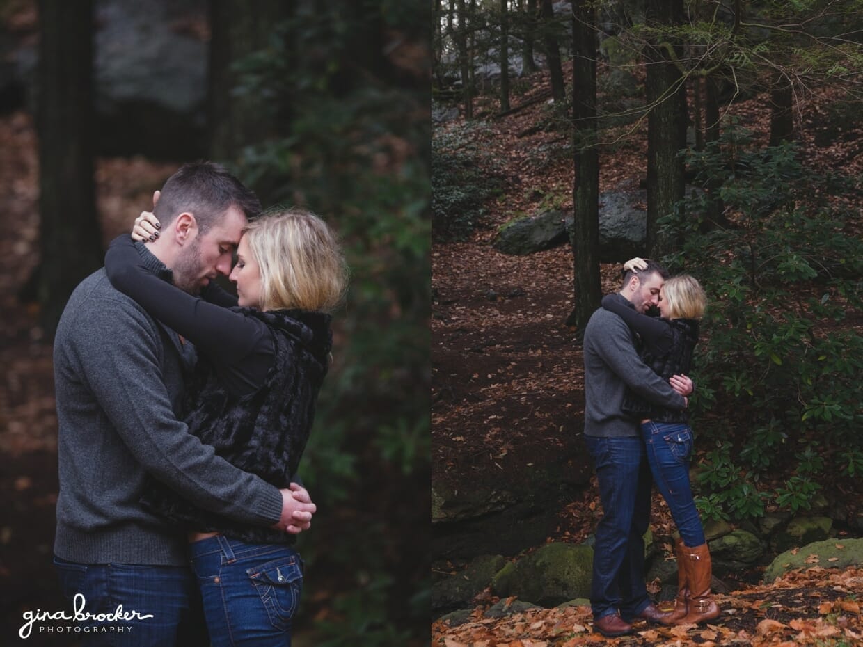 A romantic photograph of a couple hugging in the woods during their fall couple session at the Arnold Arboretum in Boston, Massachusetts