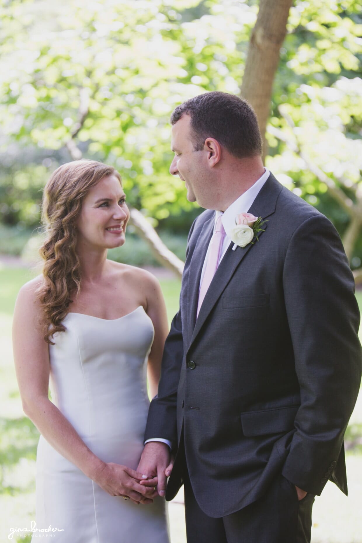 A sweet portrait of a bride and groom laughing during the first look at their classic and elegant wedding in Boston, Massachusetts