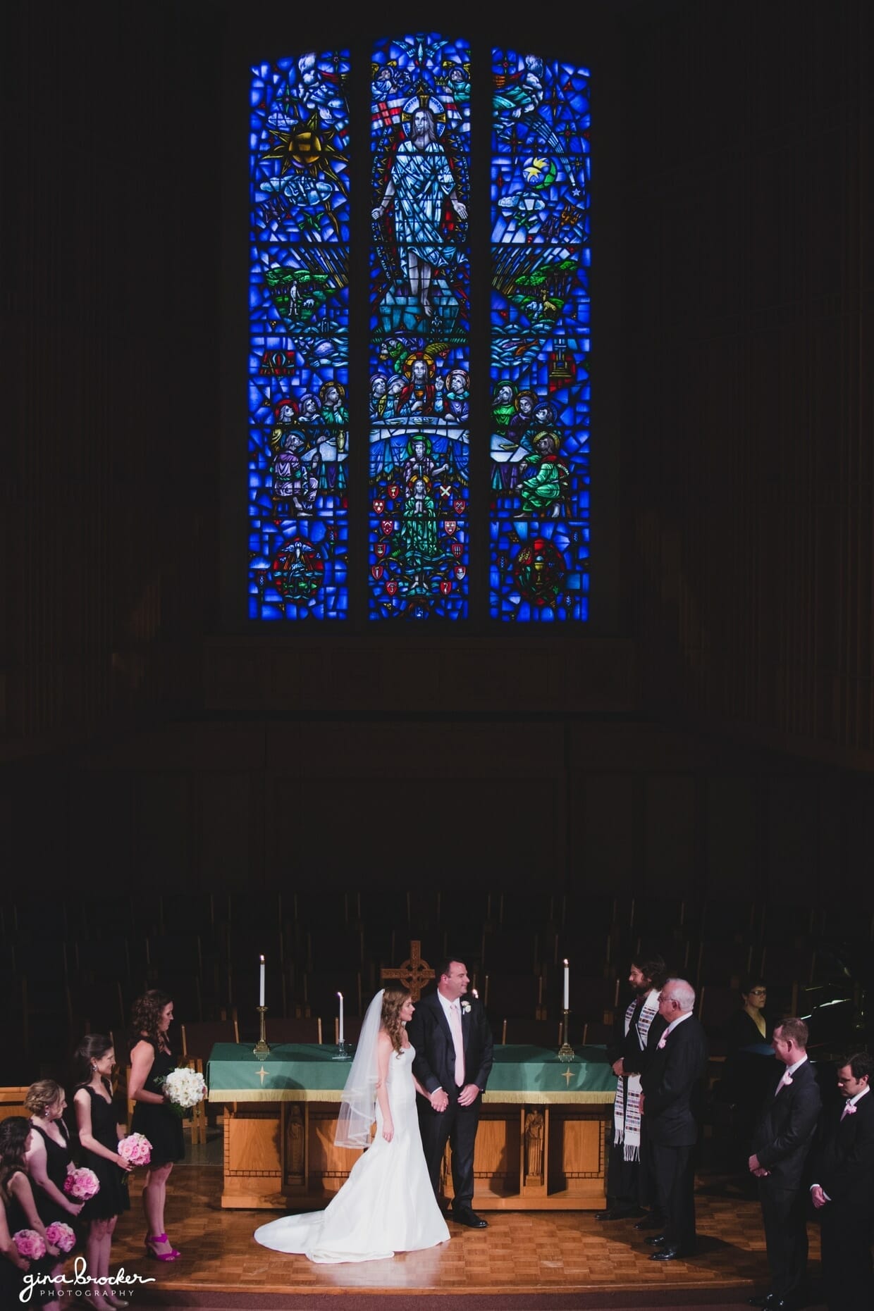 A bride and groom exchange vows during the church ceremony at their elegant and classic Boston Wedding