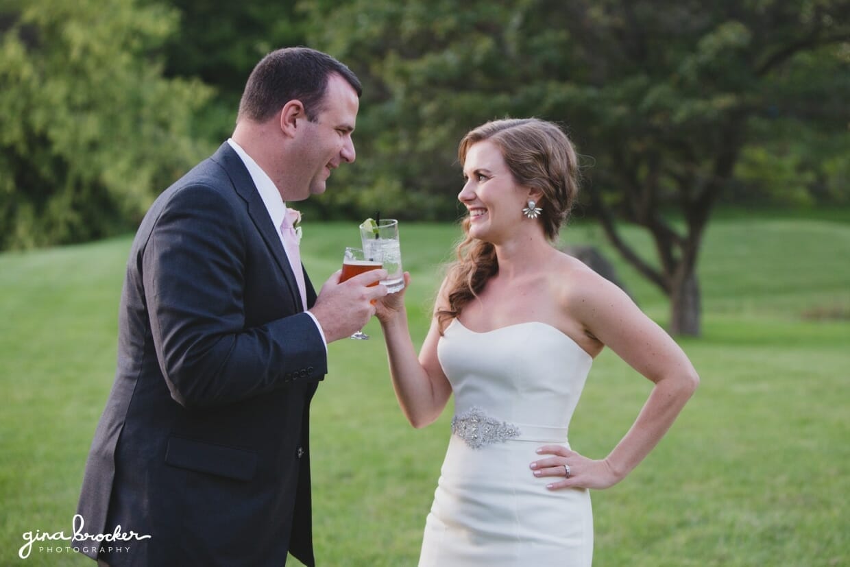 A bride and groom celebrate during their classic and elegant Boston Wedding in Massachusetts