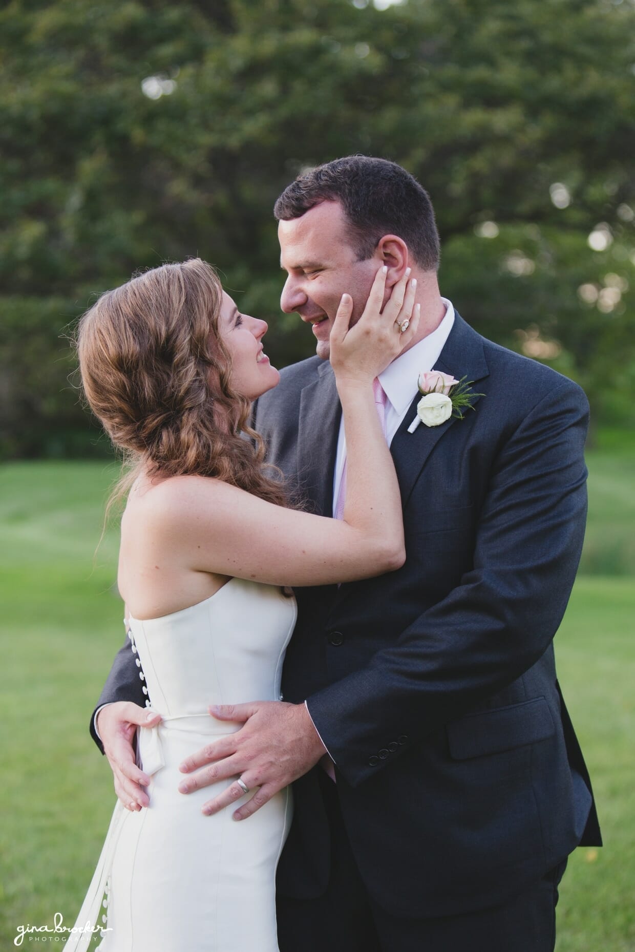 A sweet portrait of a bride looking up at her husband during the sunset portrait session of their classic and elegant Boston wedding in Massachusetts