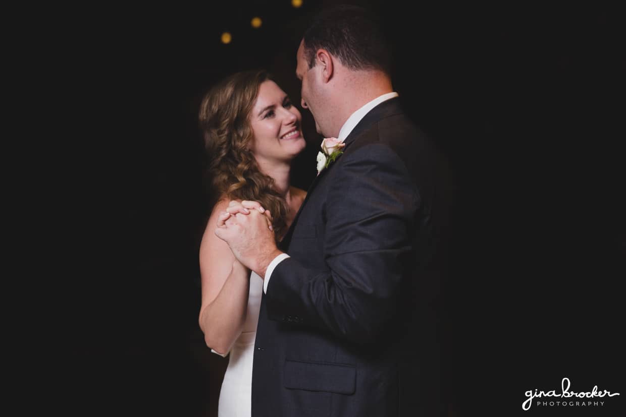 The bride and groom share a first dance as husband and wife during their classic and elegant Boston Wedding