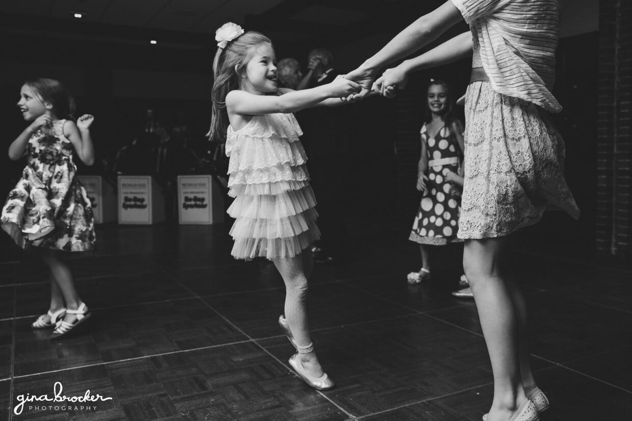 Kids dance and spin during a classic and elegant wedding reception in Boston, Massachusetts