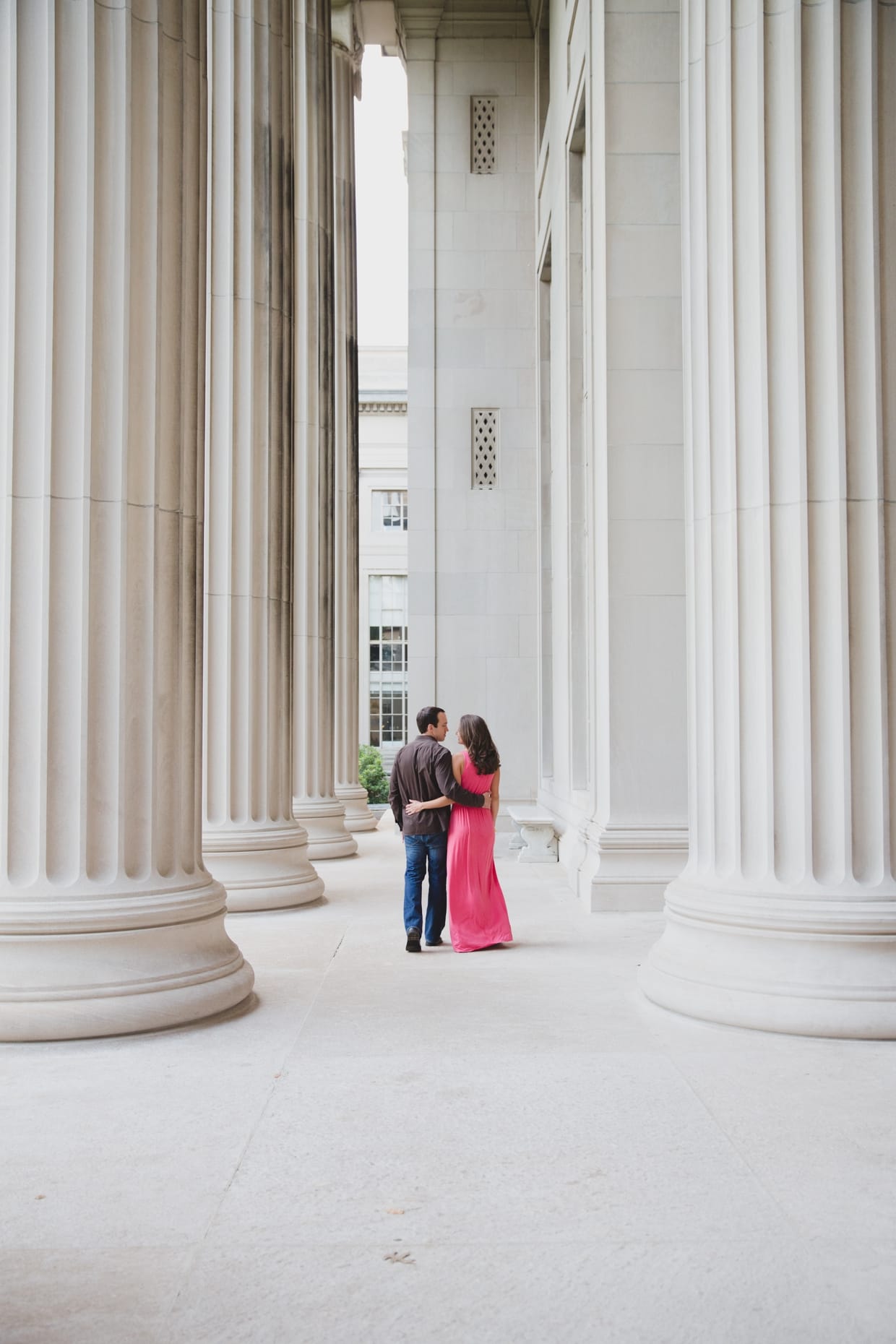 A beautiful photograph of a couple walking together at the Massachusetts Institute of Technology during their couple session