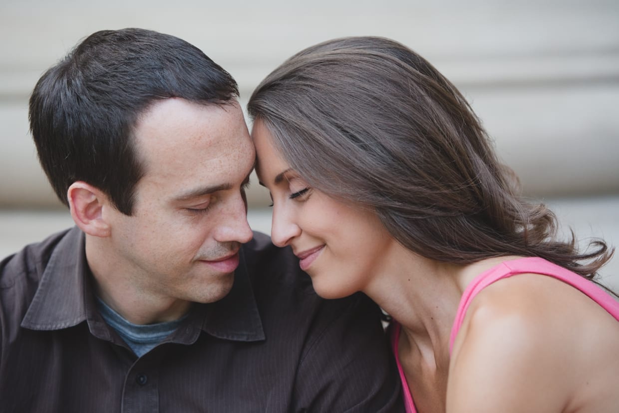 A sweet and romantic photograph of a couple on the steps of the Massachusetts Institute of Technology in Cambridge