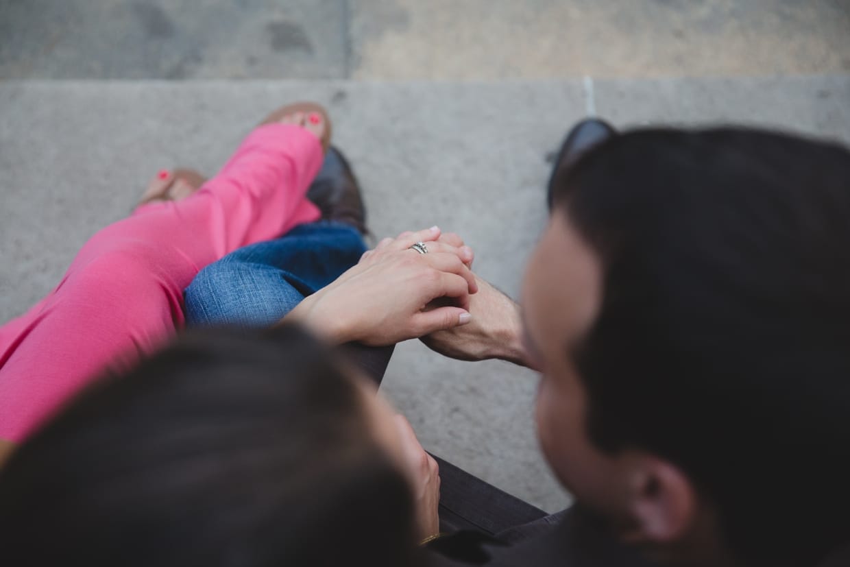An artistic and unique photograph of a couple holding hands on the steps of the Massachusetts Institute of Technology in Cambridge.