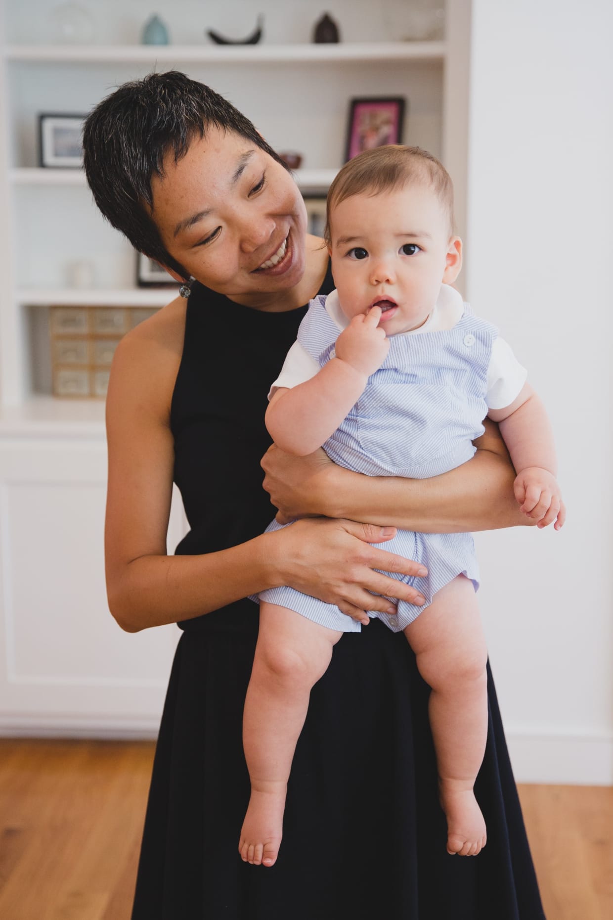 A sweet portrait of a mother holding her baby boy in their Jamaica Plain home during a family photo session