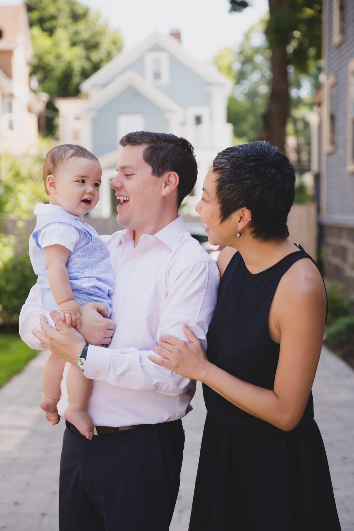 A beautiful photograph of a family outside their Jamaica Plain home during a family photo session.