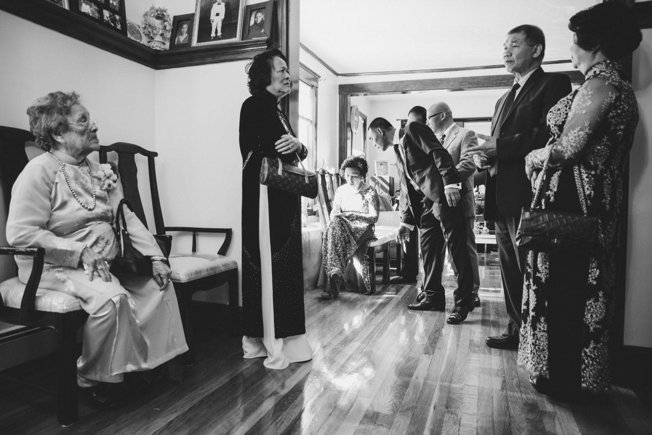 The brides family prepares for the vietnamese tea ceremony in their family home in Boston