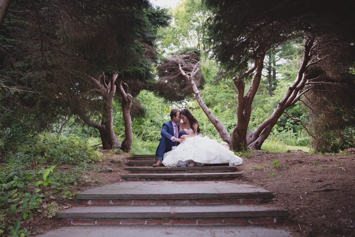 An intimate wedding portrait on the steps of the Minute Man Park in Massachusetts