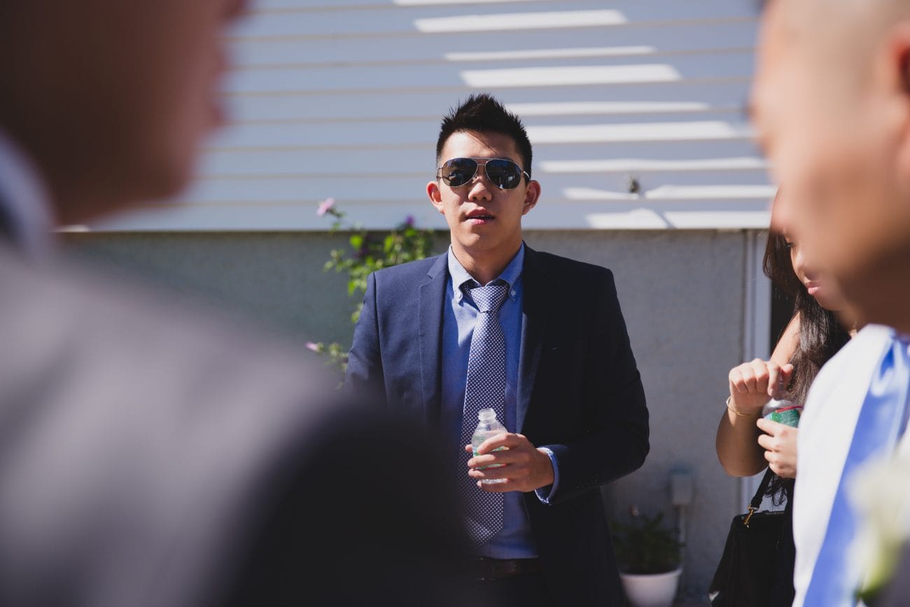 A candid photograph of the guests enjoying the sun after a vietnamese tea ceremony in Boston