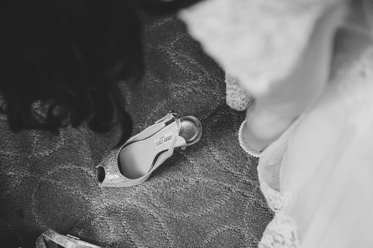 A bride puts on her Jimmy Choo shoes before her wedding at the Boston Marriott Hotel in Massachusetts