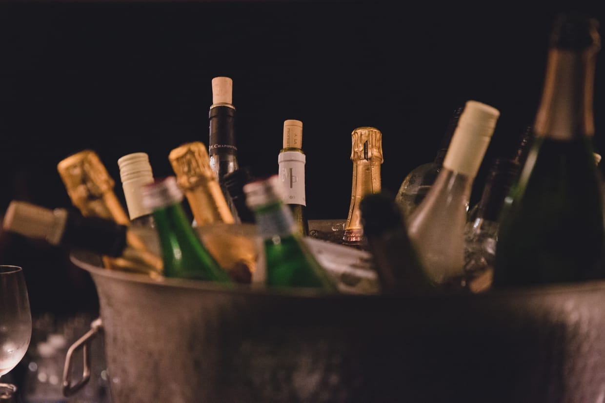 A detailed photograph of the wine and champagne served at a backyard wedding in Massachusetts