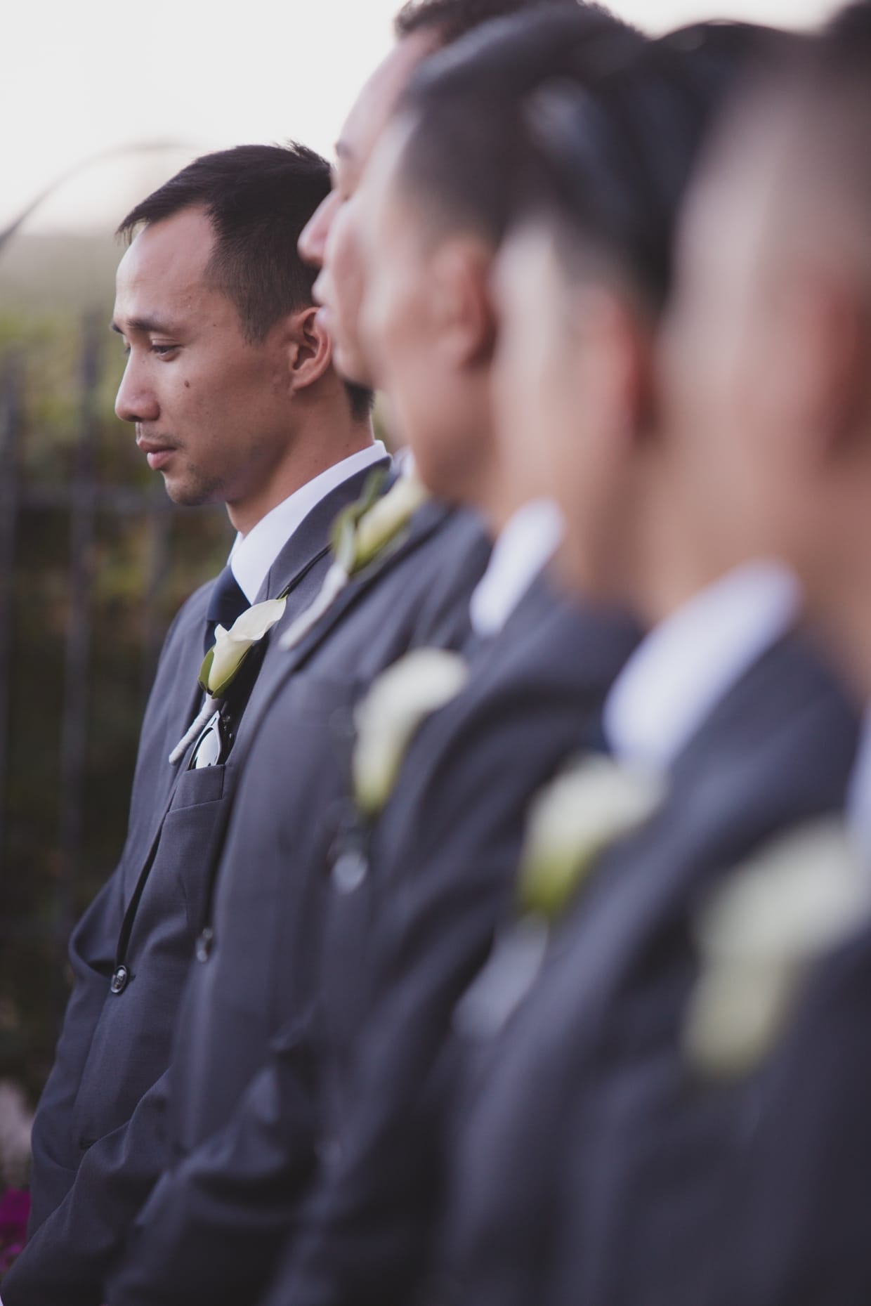 An artistic photograph of the groomsmen during a wedding ceremony at the Boston Marriott Hotel