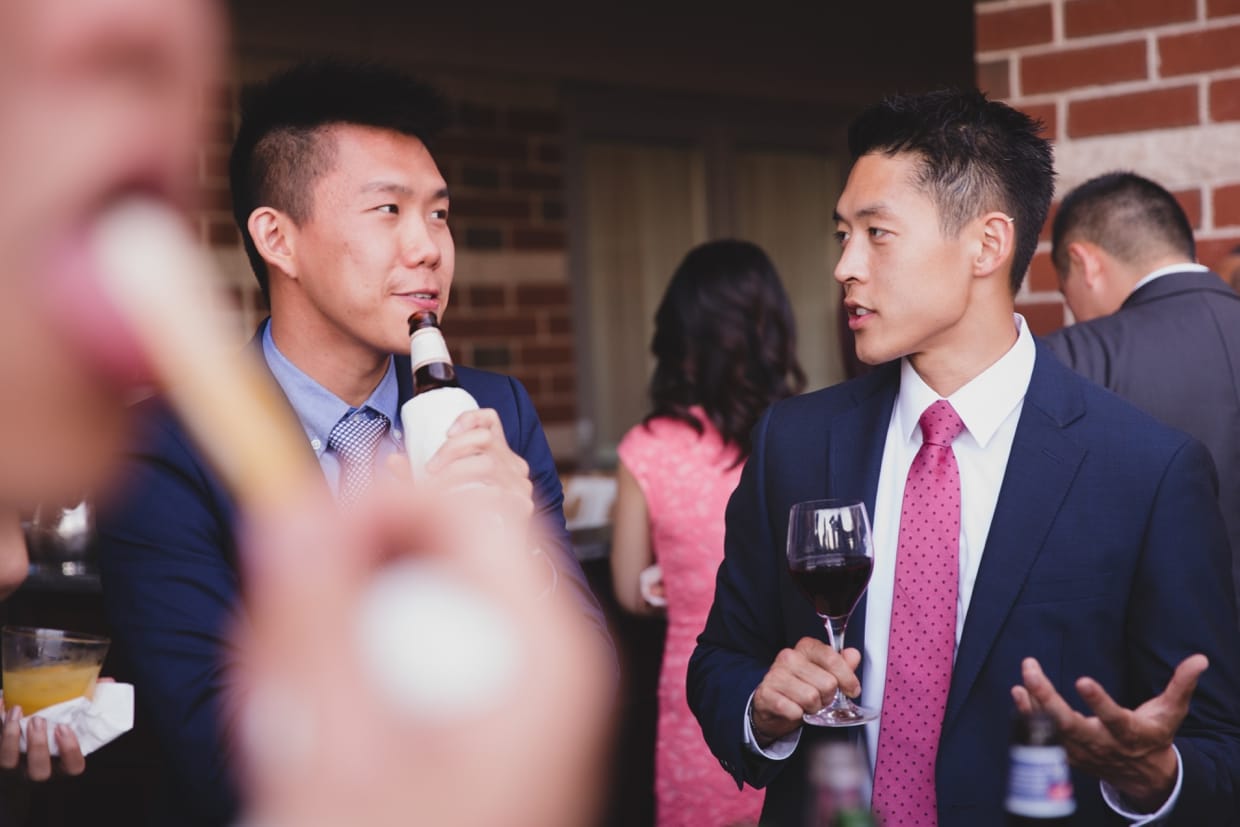 A canid photograph of guest enjoying the cocktail hour at a Boston Marriott Hotel Wedding