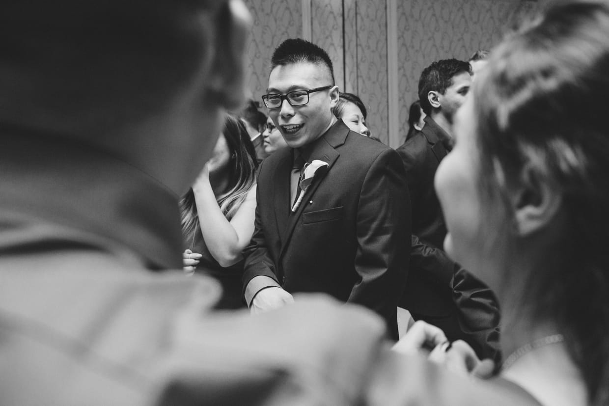 A candid photograph of a guest dancing during a wedding at the Boston Marriott Hotel