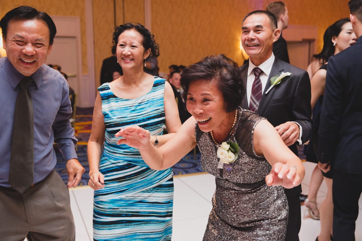 A fun photograph of guest dancing during a wedding at the Boston Marriott Hotel