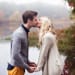 A natural and intimate portrait of couple kissing during their engagement session on the Charles River in Boston