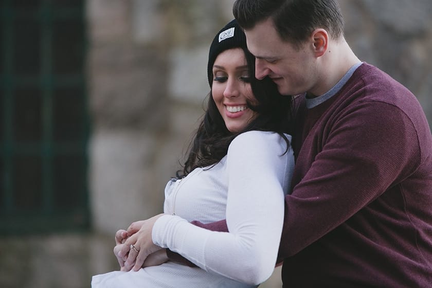 A sweet portrait of a couple cuddling during their engagement session at Borderland State Park