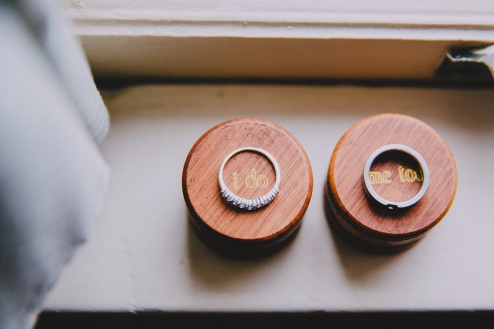 An artistic photograph of two wedding rings on the morning of a New Hampshire wedding at Kitz Farm