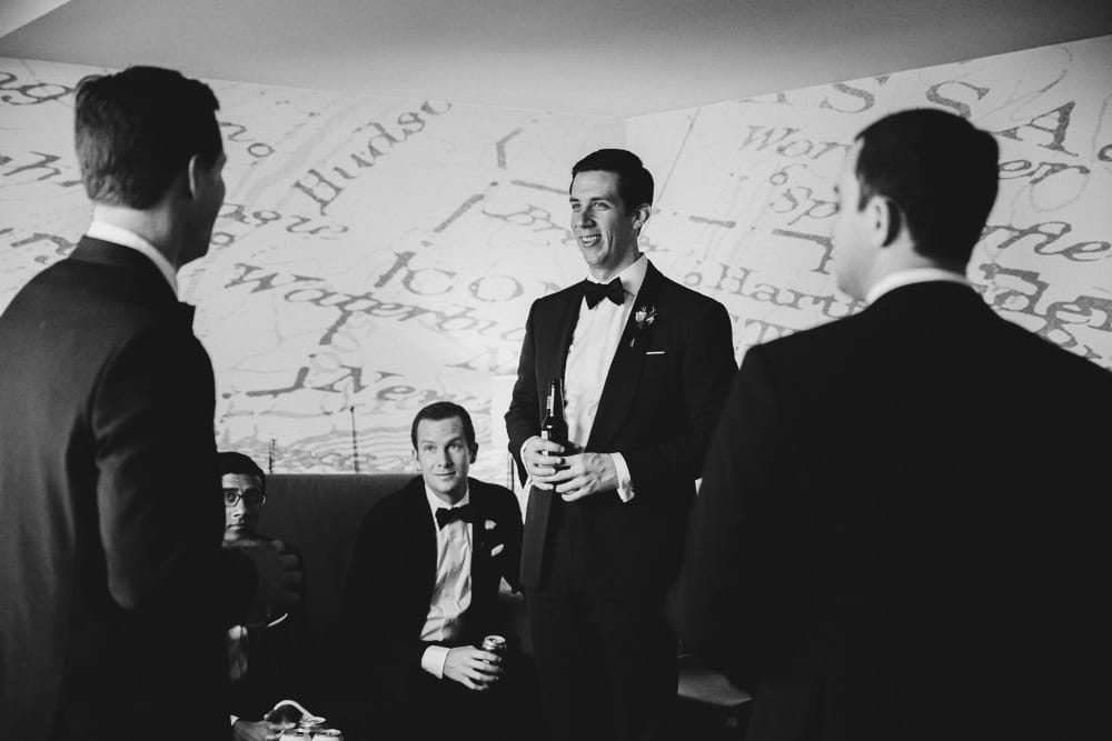 A documentary photograph of a groom and his groomsmen at the Hyatt Regency Hotel before his wedding in Newport, Rhode Island