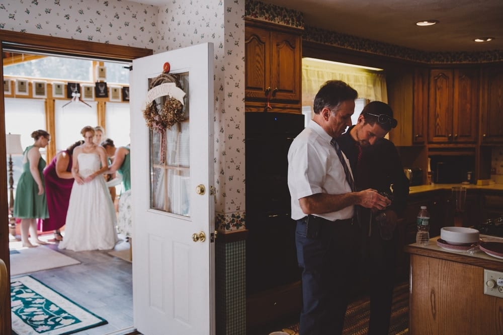 A photojournalistic image of a bride getting ready for her rustic River Club Wedding at her family home in Scituate, Massachusetts