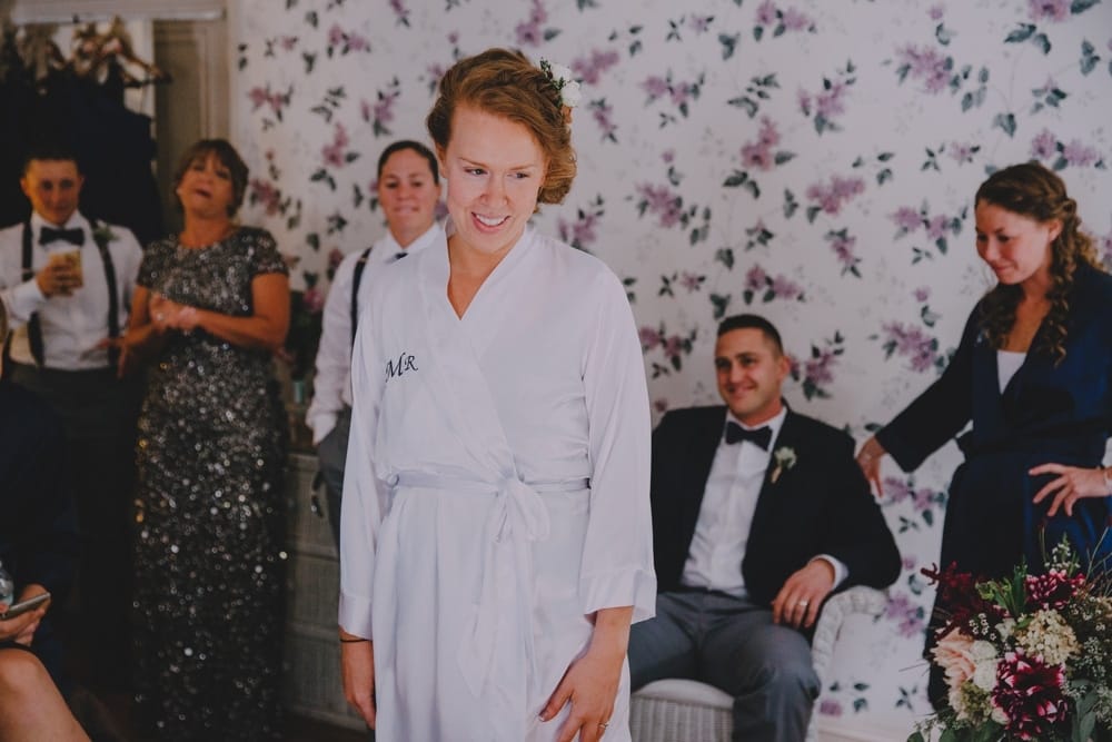 A documentary photograph of a bride getting ready at the Governors Inn before her rustic DIY New Hampshire wedding at Kitz Farm
