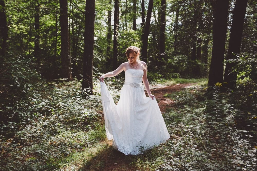 An artistic portrait of a bride in the woods during her rustic River Club Wedding in Scituate, Massachusetts