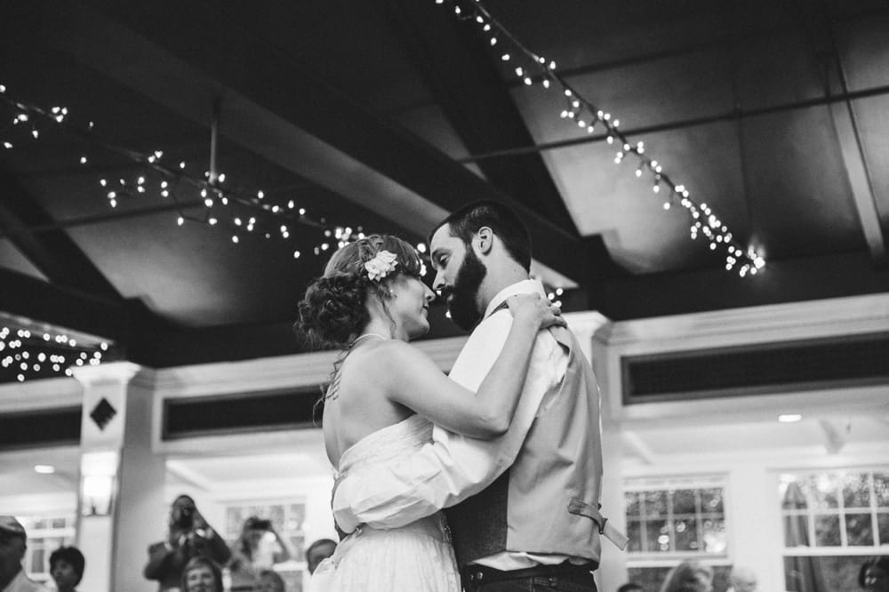 A documentary photograph of a bride and groom sharing their first dance as husband and wife during a rustic and relaxed River Club Wedding in Scituate, Massachusetts