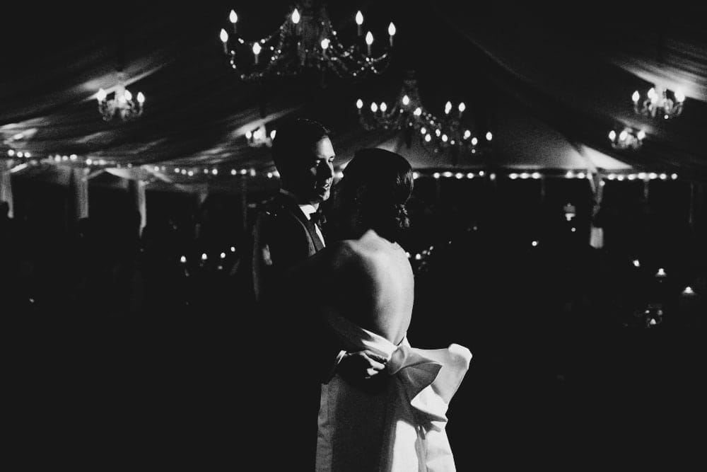 A documentary photograph of a bride and groom having their first dance during their Castle Hill Inn Wedding in Newport, Rhode Island