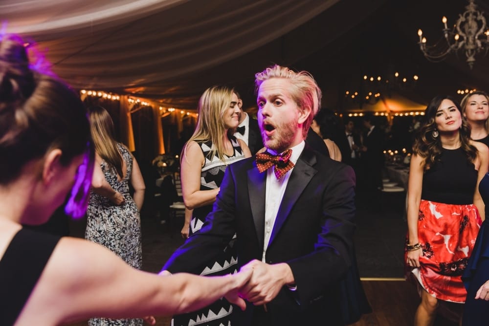 A fun photojournalistic photograph of a couple dancing at a Castle Hill Inn Wedding in Newport, Rhode Island