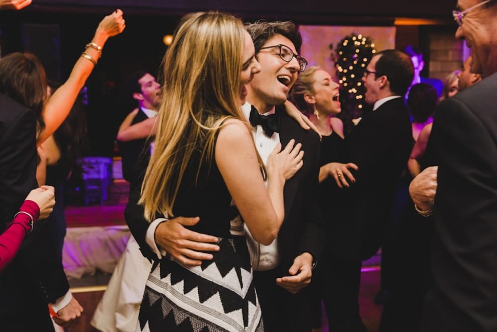 A photojournalistic photograph of a couple dancing during a wedding at the Castle Hill Inn in Newport, Rhode Island