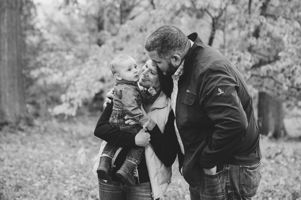A candid photograph of a family during their lifestyle mini session at the Arnold Arboretum in Boston, Massachusetts