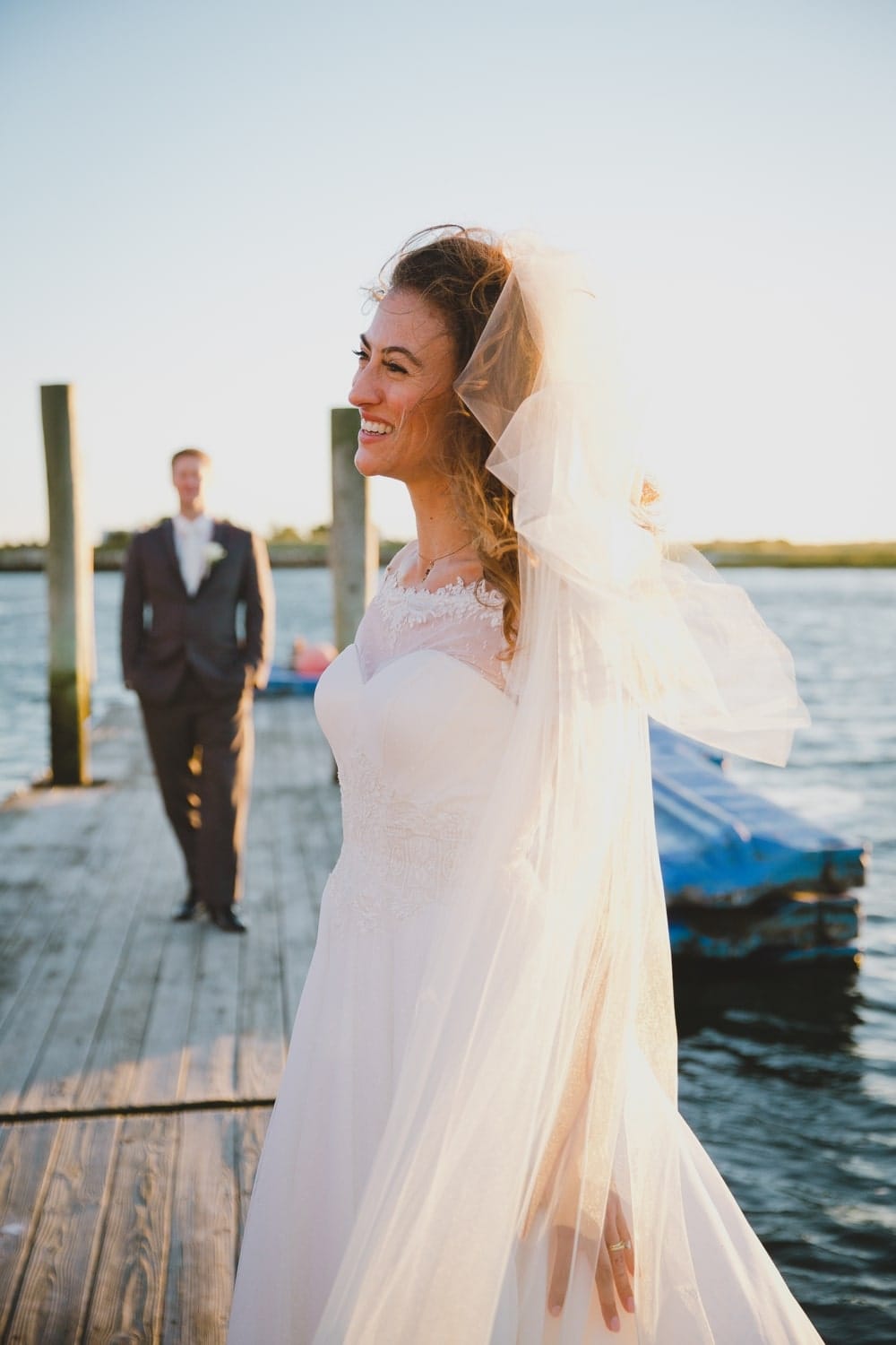 A natural portrait of a bride and groom during their summer wedding on Cape Cod