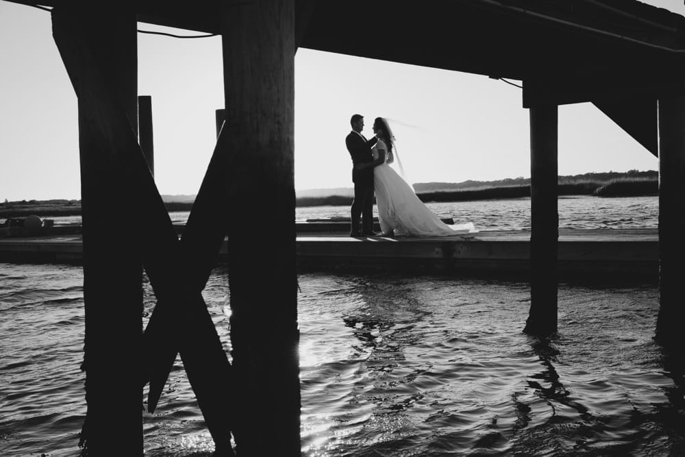 An artistic and documentary portrait of a bride and groom during their summer wedding on Cape Cod