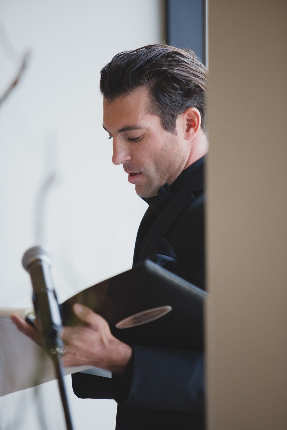 A portrait of the Groom's friend officiating the ceremony at their State Room Wedding in Boston