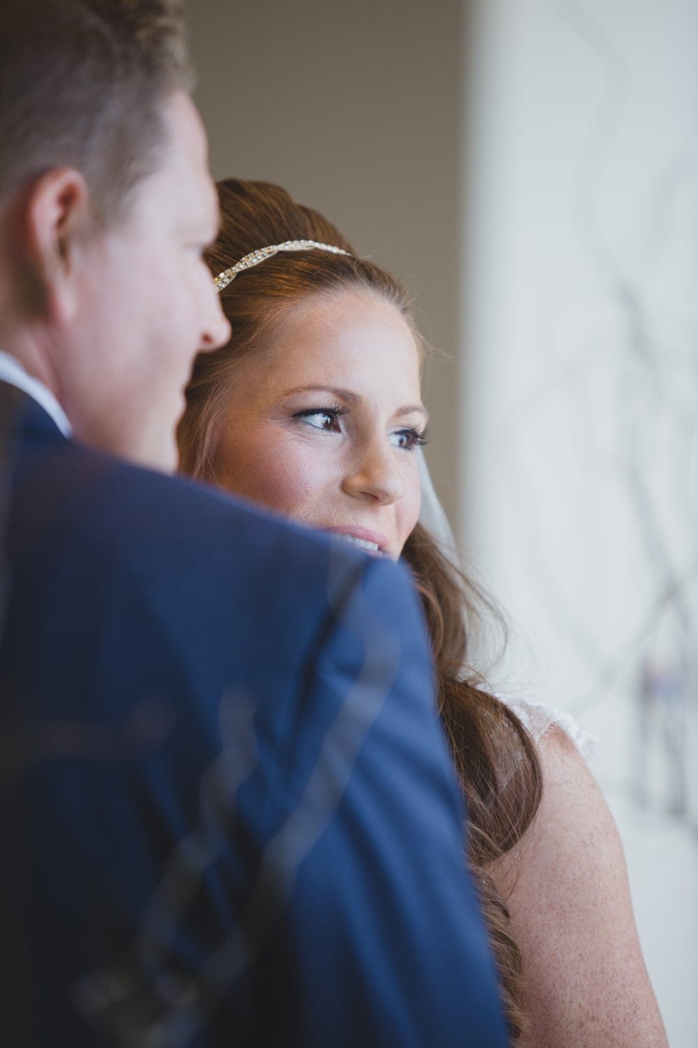 A documentary portrait of a bride and groom during their State Room Wedding Ceremony in Boston