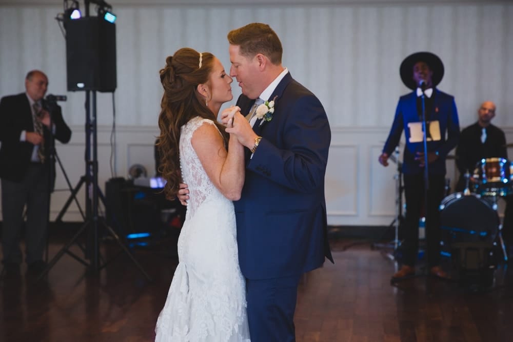 A documentary photograph of a bride and groom having their first dance as husband and wife during their State Room Wedding in Boston