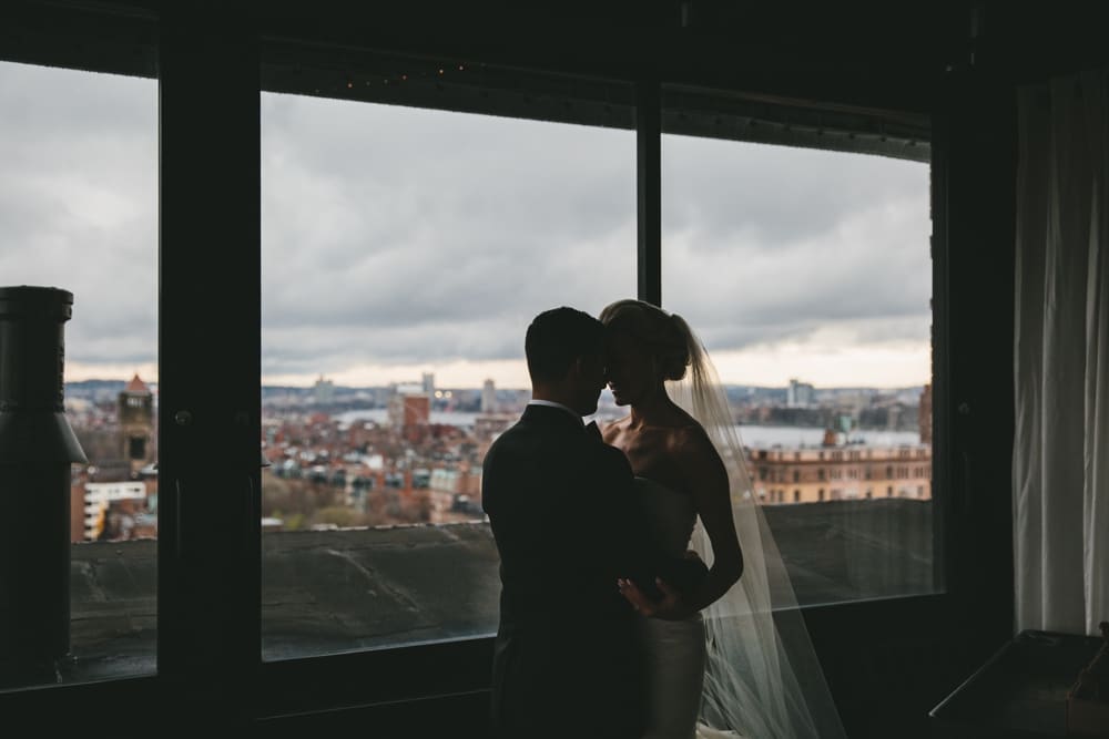 A documentary photograph of a bride and groom on the top floor of the Taj Hotel before their Boston City Wedding in Massachusetts