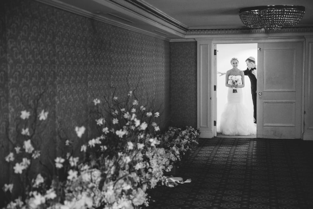 A documentary photograph of a bride getting ready to walk down the aisle during a Taj Boston Hotel Wedding in Massachusetts