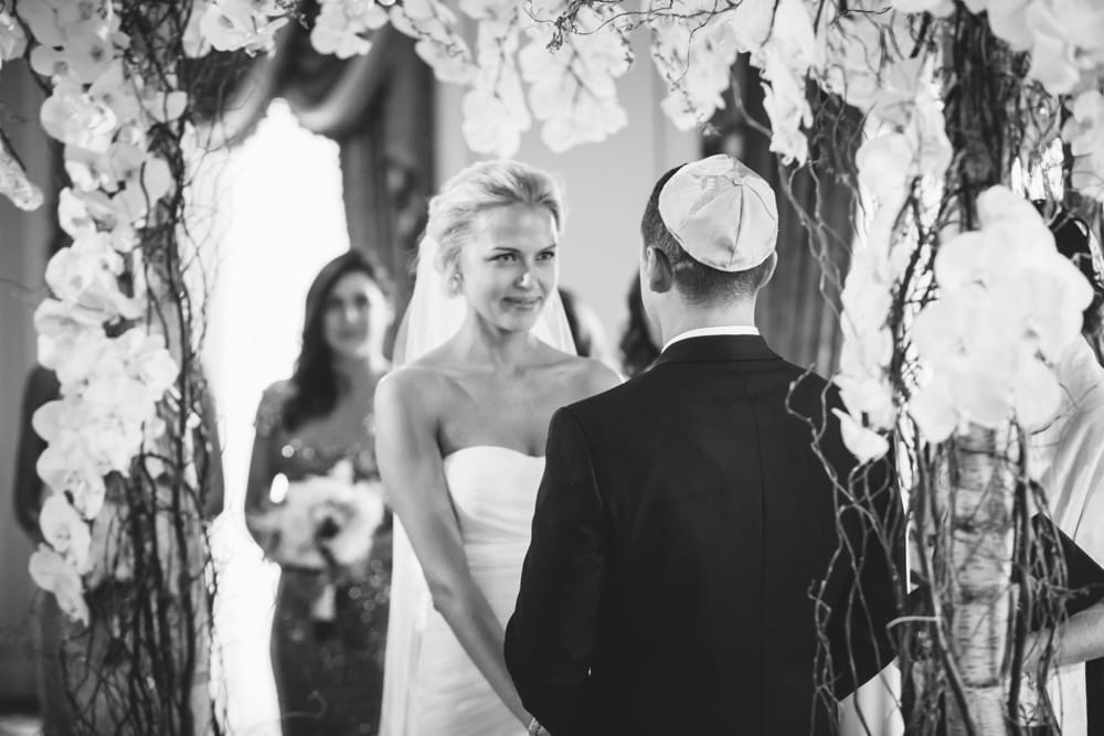 A documentary photograph of a bride and groom during saying their vows during their Taj Boston Hotel Wedding in Massachusetts