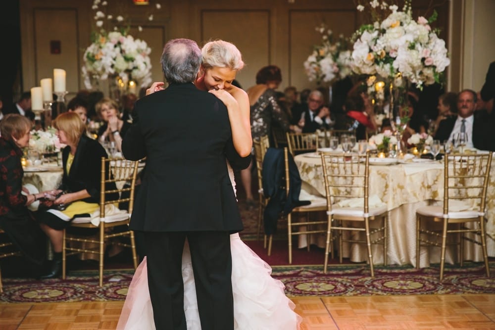 A documentary photograph of a bride having a father daughter dance during a Taj Boston Hotel Wedding in Massachusetts
